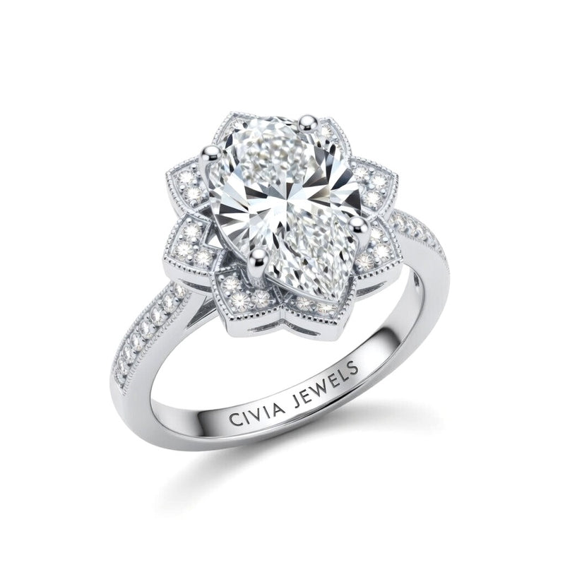 White Gold Pear Diamond Vintage Halo Engagement Ring With Four Prong Setting And Pavé Band