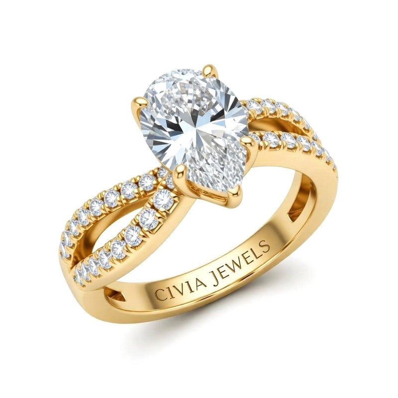 Yellow Gold Pear Diamond Twisted Shank Engagement Ring With Four Prong Setting And Pavé Side Bands