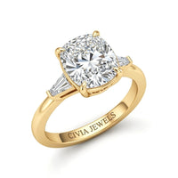 Yellow Gold Cushion Cut Three Stone Engagement Ring With Tapered Baguette Side Diamonds And Classic Four Prong Setting