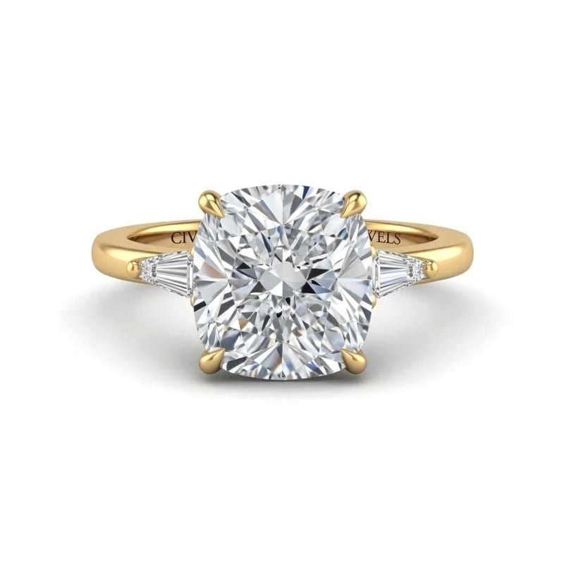 Yellow Gold Cushion Cut Three Stone Engagement Ring With Tapered Baguette Side Diamonds And Classic Four Prong Setting