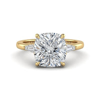 Yellow Gold Cushion Cut Three Stone Engagement Ring With Tapered Baguette Side Diamonds And Classic Four Prong Setting