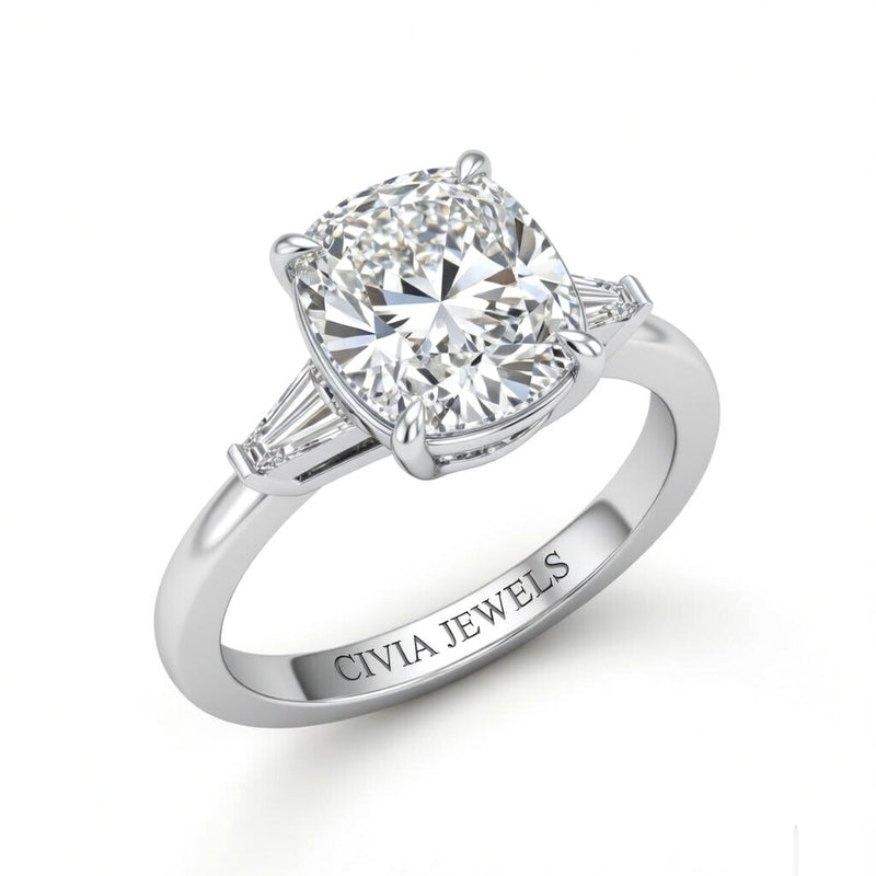 White Gold Cushion Cut Three Stone Engagement Ring With Tapered Baguette Side Diamonds And Classic Four Prong Setting