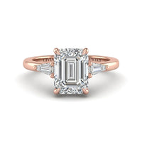 Rose Gold Emerald Cut Three Stone Engagement Ring With Tapered Baguette Side Diamonds And Classic Four Prong Setting