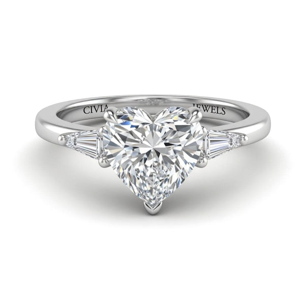White Gold Heart Cut Three Stone Engagement Ring With Tapered Baguette Side Diamonds And Classic Four Prong Setting