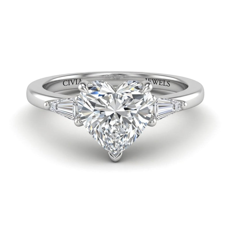 Silver Heart Cut Three Stone Engagement Ring With Tapered Baguette Side Diamonds And Classic Four Prong Setting