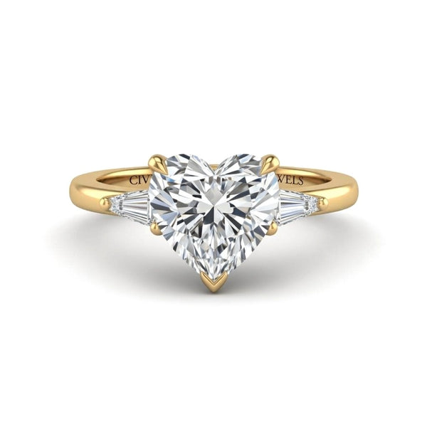 Yellow Gold Heart Cut Three Stone Engagement Ring With Tapered Baguette Side Diamonds And Classic Four Prong Setting