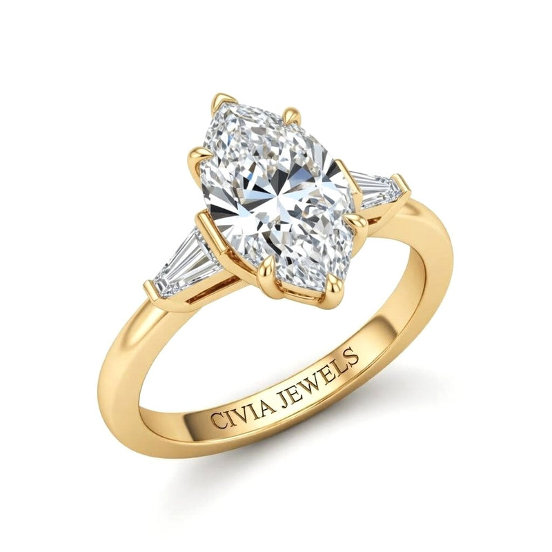 Yellow Gold Marquise Cut Three Stone Engagement Ring With Tapered Baguette Side Diamonds And Classic Four Prong Setting