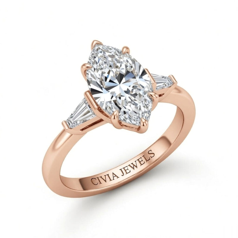 Rose Gold Marquise Cut Three Stone Engagement Ring With Tapered Baguette Side Diamonds And Classic Four Prong Setting