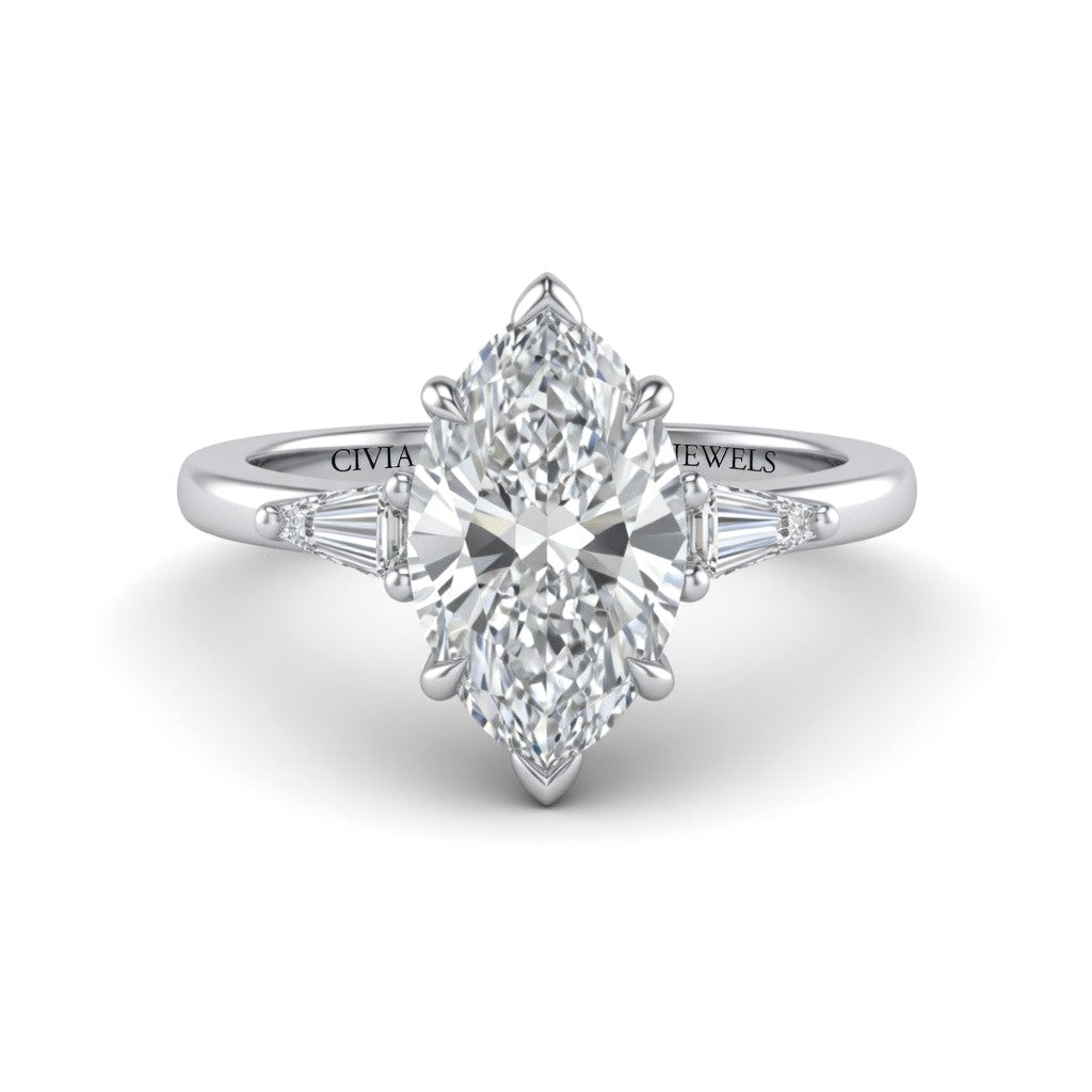 White Gold Marquise Cut Three Stone Engagement Ring With Tapered Baguette Side Diamonds And Classic Four Prong Setting