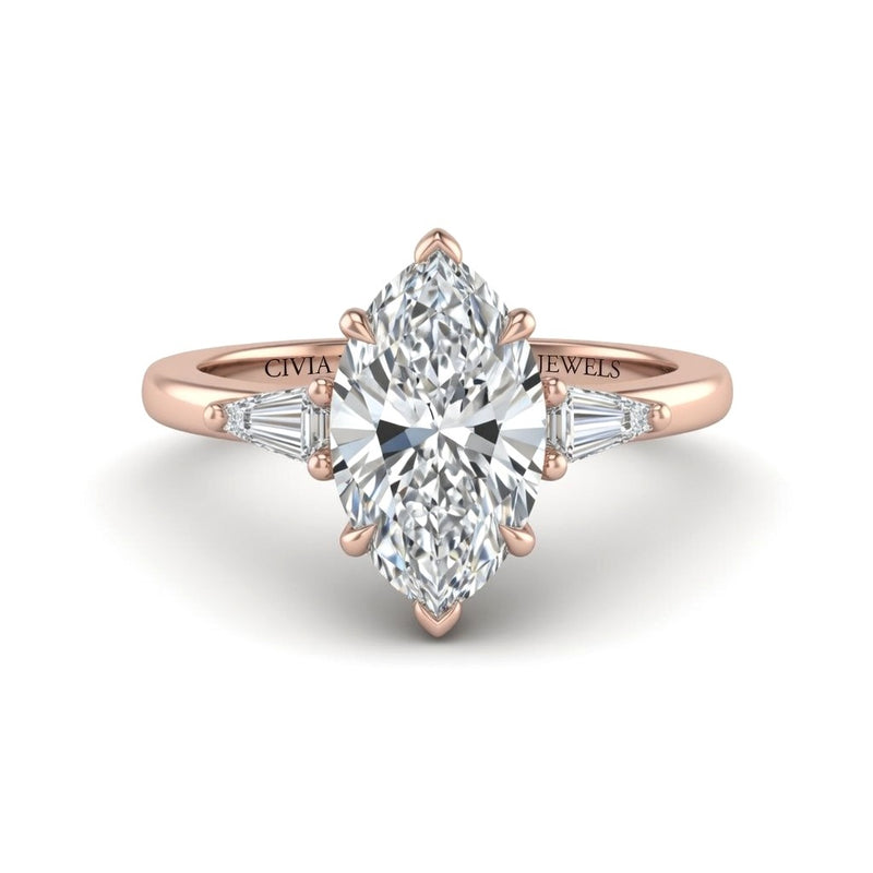 Rose Gold Marquise Cut Three Stone Engagement Ring With Tapered Baguette Side Diamonds And Classic Four Prong Setting