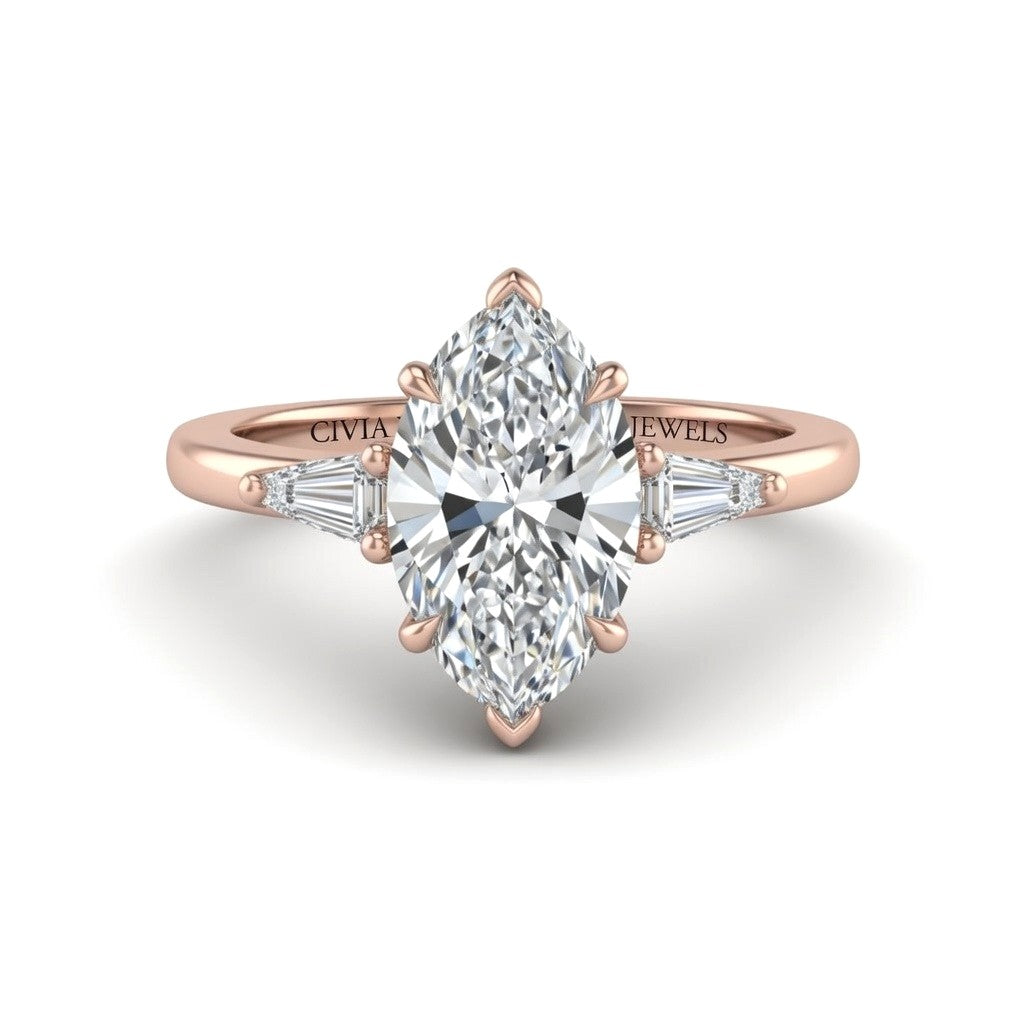Rose Gold Marquise Cut Three Stone Engagement Ring With Tapered Baguette Side Diamonds And Classic Four Prong Setting