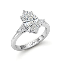 Silver Marquise Cut Three Stone Engagement Ring With Tapered Baguette Side Diamonds And Classic Four Prong Setting