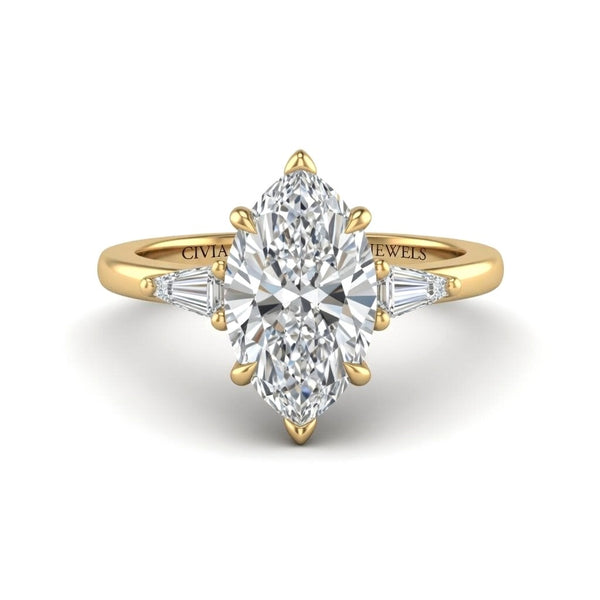 Yellow Gold Marquise Cut Three Stone Engagement Ring With Tapered Baguette Side Diamonds And Classic Four Prong Setting