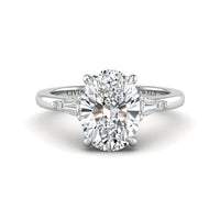 White Gold Oval Cut Three Stone Engagement Ring With Tapered Baguette Side Diamonds And Classic Four Prong Setting