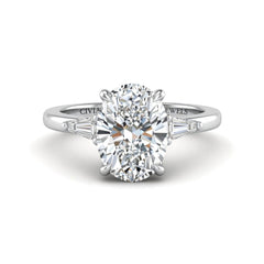 White Gold Oval Cut Three Stone Engagement Ring With Tapered Baguette Side Diamonds And Classic Four Prong Setting