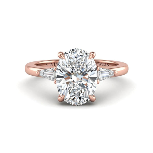 Rose Gold Oval Cut Three Stone Engagement Ring With Tapered Baguette Side Diamonds And Classic Four Prong Setting
