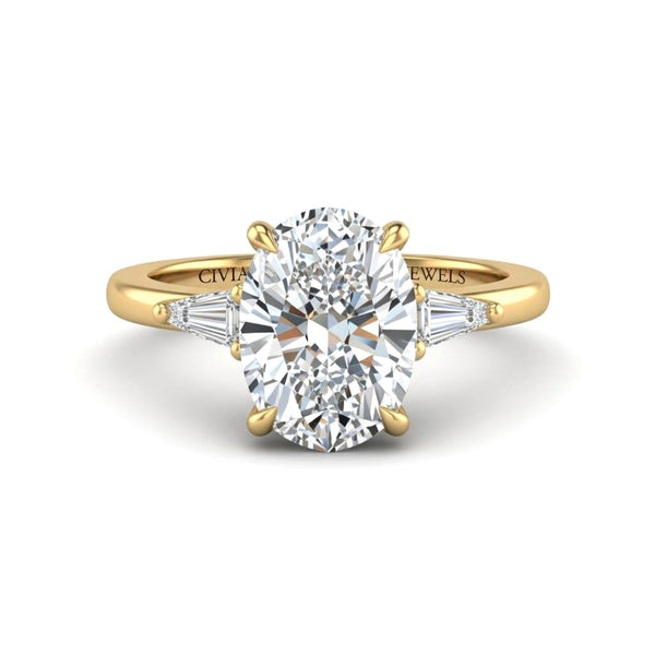 Yellow Gold Oval Cut Three Stone Engagement Ring With Tapered Baguette Side Diamonds And Classic Four Prong Setting