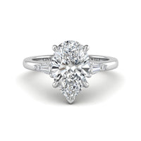 Silver Pear Cut Three Stone Engagement Ring With Tapered Baguette Side Diamonds And Classic Four Prong Setting