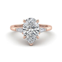 Rose Gold Pear Cut Three Stone Engagement Ring With Tapered Baguette Side Diamonds And Classic Four Prong Setting