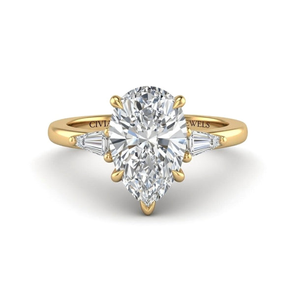 Yellow Gold Pear Cut Three Stone Engagement Ring With Tapered Baguette Side Diamonds And Classic Four Prong Setting