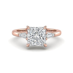 Rose Gold Princess Cut Three Stone Engagement Ring With Tapered Baguette Side Diamonds And Classic Four Prong Setting