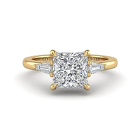 Yellow Gold Princess Cut Three Stone Engagement Ring With Tapered Baguette Side Diamonds And Classic Four Prong Setting