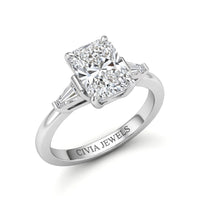 Silver Radiant Cut Three Stone Engagement Ring With Tapered Baguette Side Diamonds And Classic Four Prong Setting