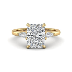 Yellow Gold Radiant Cut Three Stone Engagement Ring With Tapered Baguette Side Diamonds And Classic Four Prong Setting