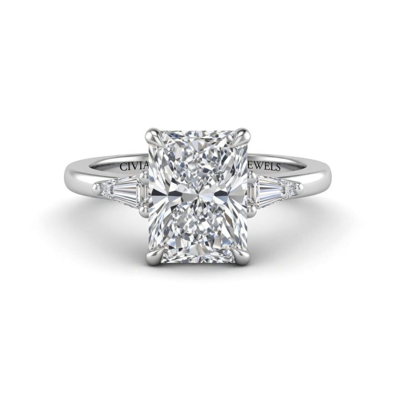 Silver Radiant Cut Three Stone Engagement Ring With Tapered Baguette Side Diamonds And Classic Four Prong Setting