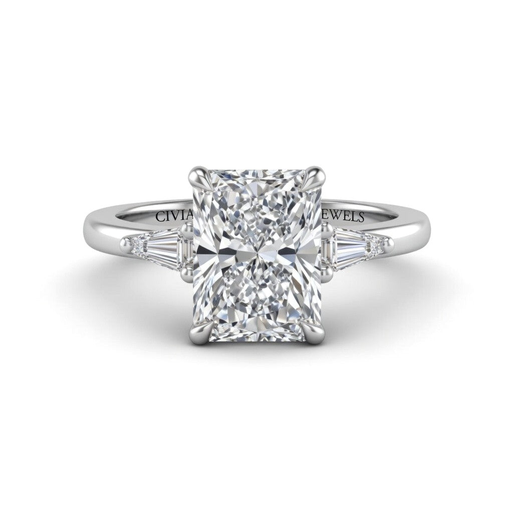 Silver Radiant Cut Three Stone Engagement Ring With Tapered Baguette Side Diamonds And Classic Four Prong Setting