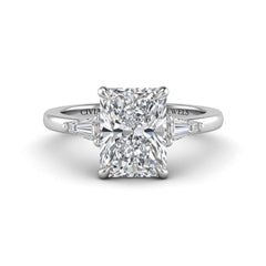 Silver Radiant Cut Three Stone Engagement Ring With Tapered Baguette Side Diamonds And Classic Four Prong Setting
