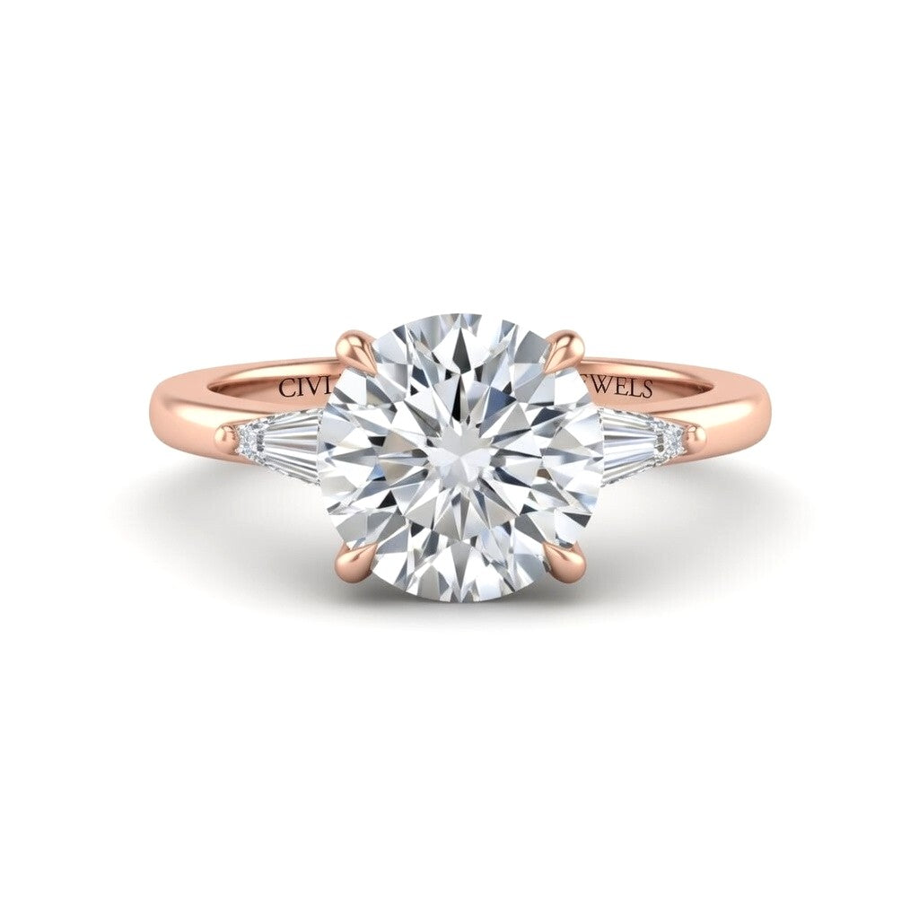 Rose Gold Round Cut Three Stone Engagement Ring With Tapered Baguette Side Diamonds And Classic Four Prong Setting