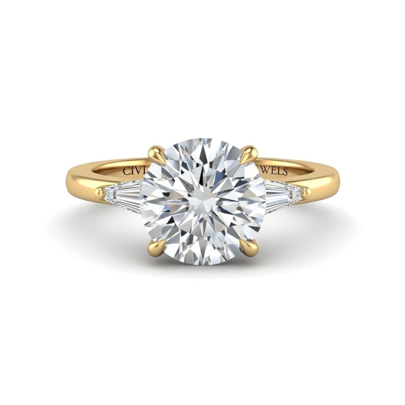 Yellow Gold Round Cut Three Stone Engagement Ring With Tapered Baguette Side Diamonds And Classic Four Prong Setting
