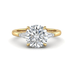 Yellow Gold Round Cut Three Stone Engagement Ring With Tapered Baguette Side Diamonds And Classic Four Prong Setting
