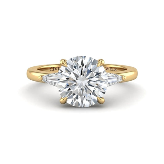 Yellow Gold Round Cut Three Stone Engagement Ring With Tapered Baguette Side Diamonds And Classic Four Prong Setting
