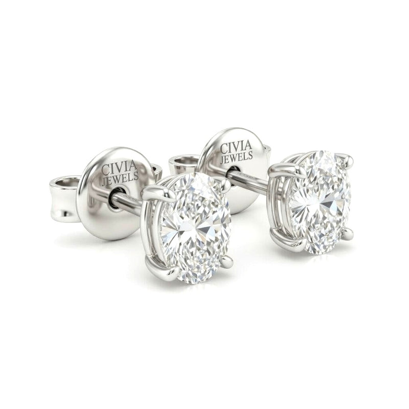 White Gold Oval Cut Diamond Stud Earrings With Four Prong Setting