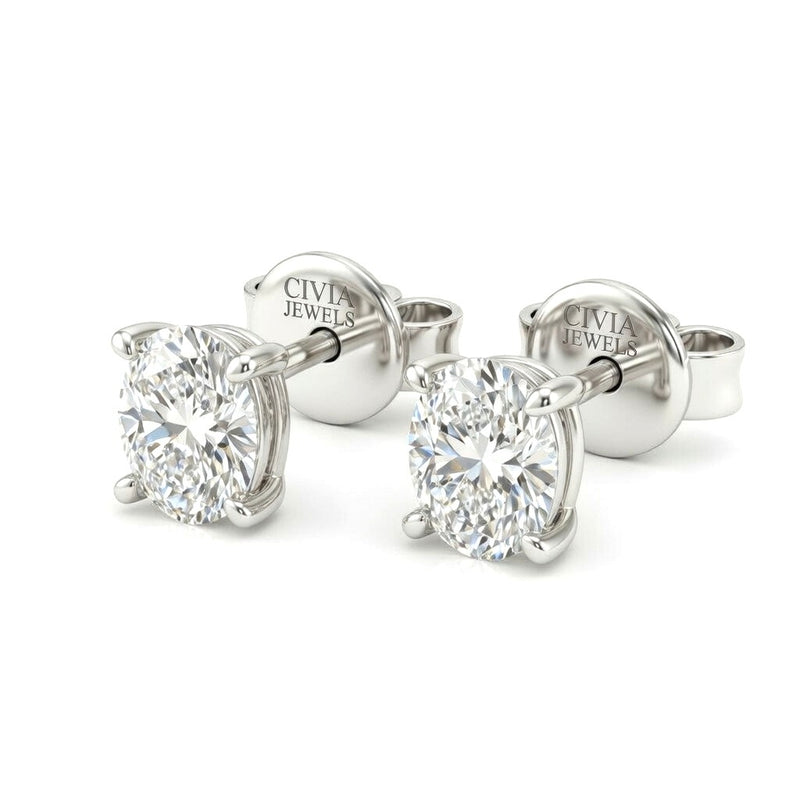 White Gold Oval Cut Diamond Stud Earrings With Four Prong Setting