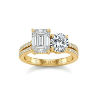Yellow Gold Emerald & Round Diamond Modern Two Stone Ring With Side Diamonds
