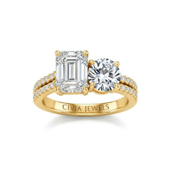 Yellow Gold Emerald & Round Diamond Modern Two Stone Ring With Side Diamonds