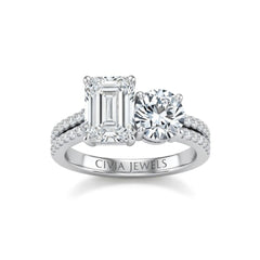 White Gold Emerald & Round Diamond Modern Two Stone Ring With Side Diamonds