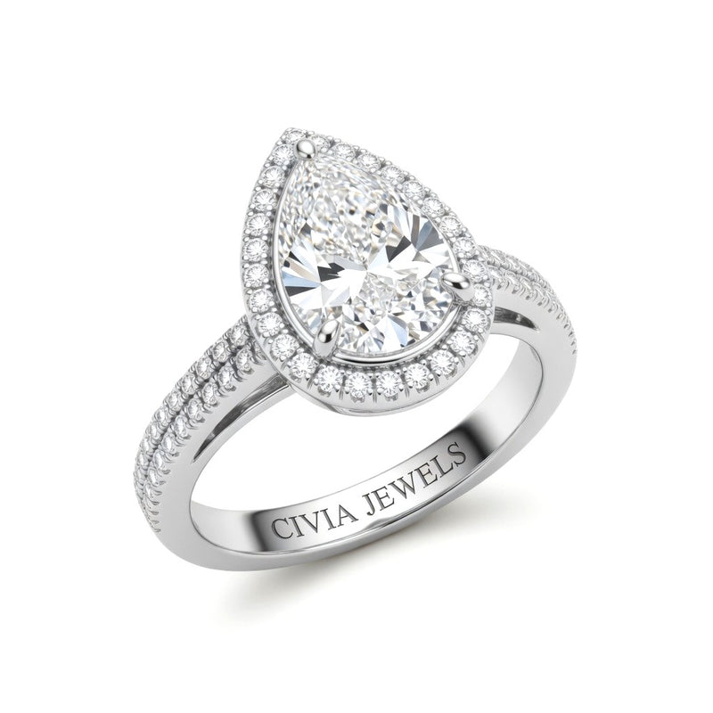Silver Pear Cut Diamond Halo Engagement Ring With Four Prong Setting And Pavé Band