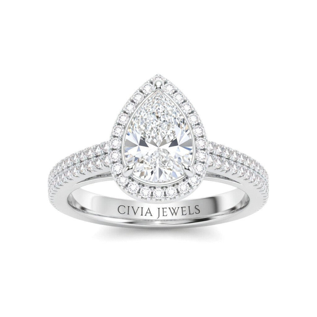 White Gold Pear Cut Diamond Halo Engagement Ring With Four Prong Setting And Pavé Band