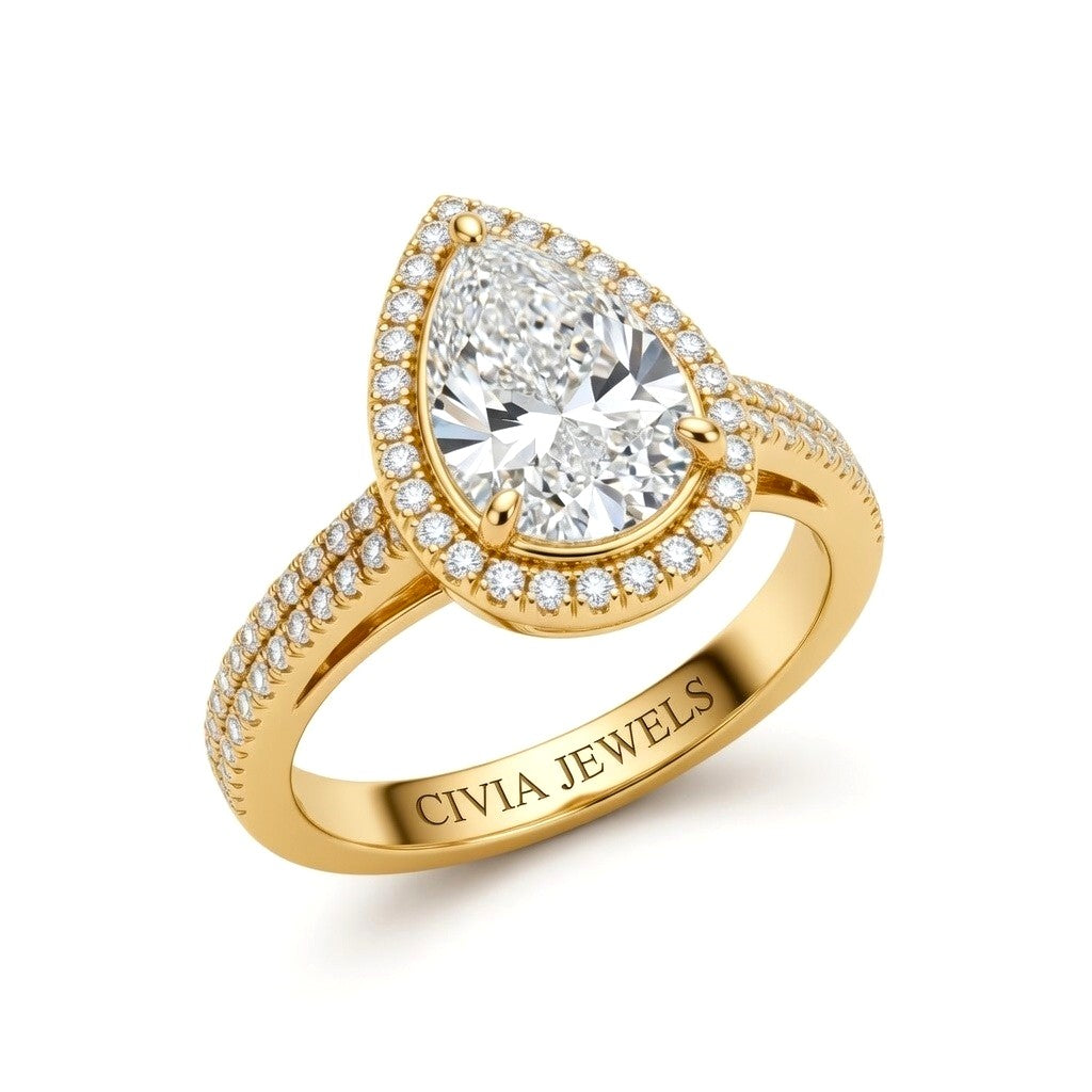 Yellow Gold Pear Cut Diamond Halo Engagement Ring With Four Prong Setting And Pavé Band