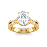 Yellow Gold Oval Diamond Engagement Ring With Twisted Pavé Band And Four Prong Solitaire Setting