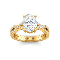 Yellow Gold Oval Diamond Engagement Ring With Twisted Pavé Band And Four Prong Solitaire Setting