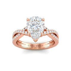 Rose Gold Pear Diamond Engagement Ring With Twisted Pavé Band And Four Prong Solitaire Setting