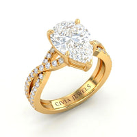 Yellow Gold Pear Diamond Engagement Ring With Twisted Pavé Band And Four Prong Solitaire Setting