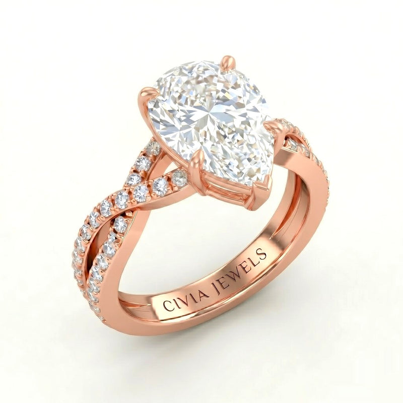 Rose Gold Pear Diamond Engagement Ring With Twisted Pavé Band And Four Prong Solitaire Setting