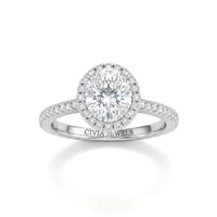 Silver Oval Diamond Halo Engagement Ring With Pavé Band Design