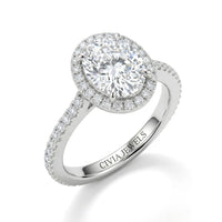 Silver Oval Diamond Halo Engagement Ring With Pavé Band Design